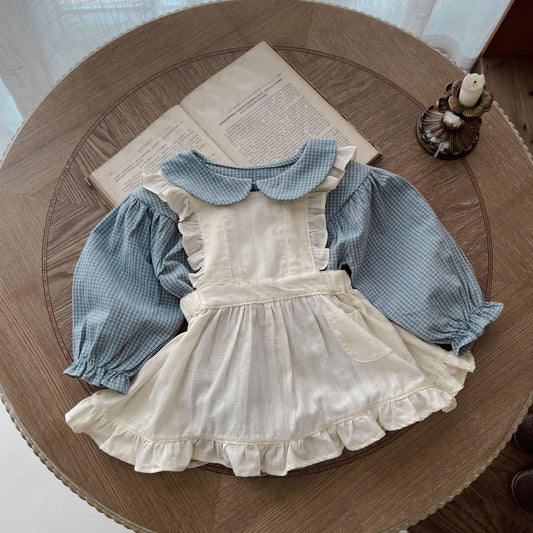 Combinaison bébé à manches longues, boutonnage simple, petit carreau et petite surjupe à bretelles