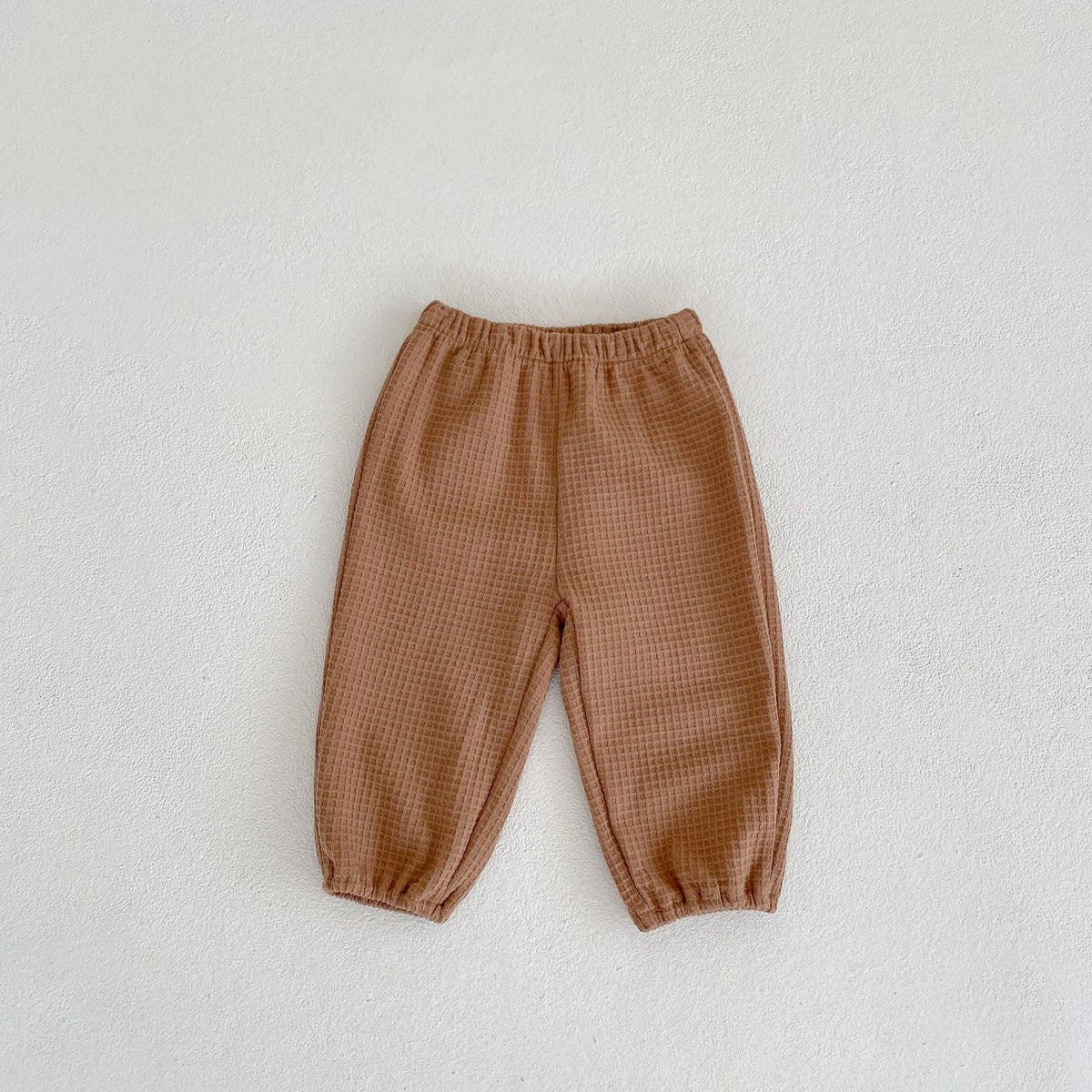 Pantalon ample et polyvalent pour enfants en tissu gaufré