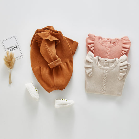 Combinaison bébé en tricot à petites manches volantées