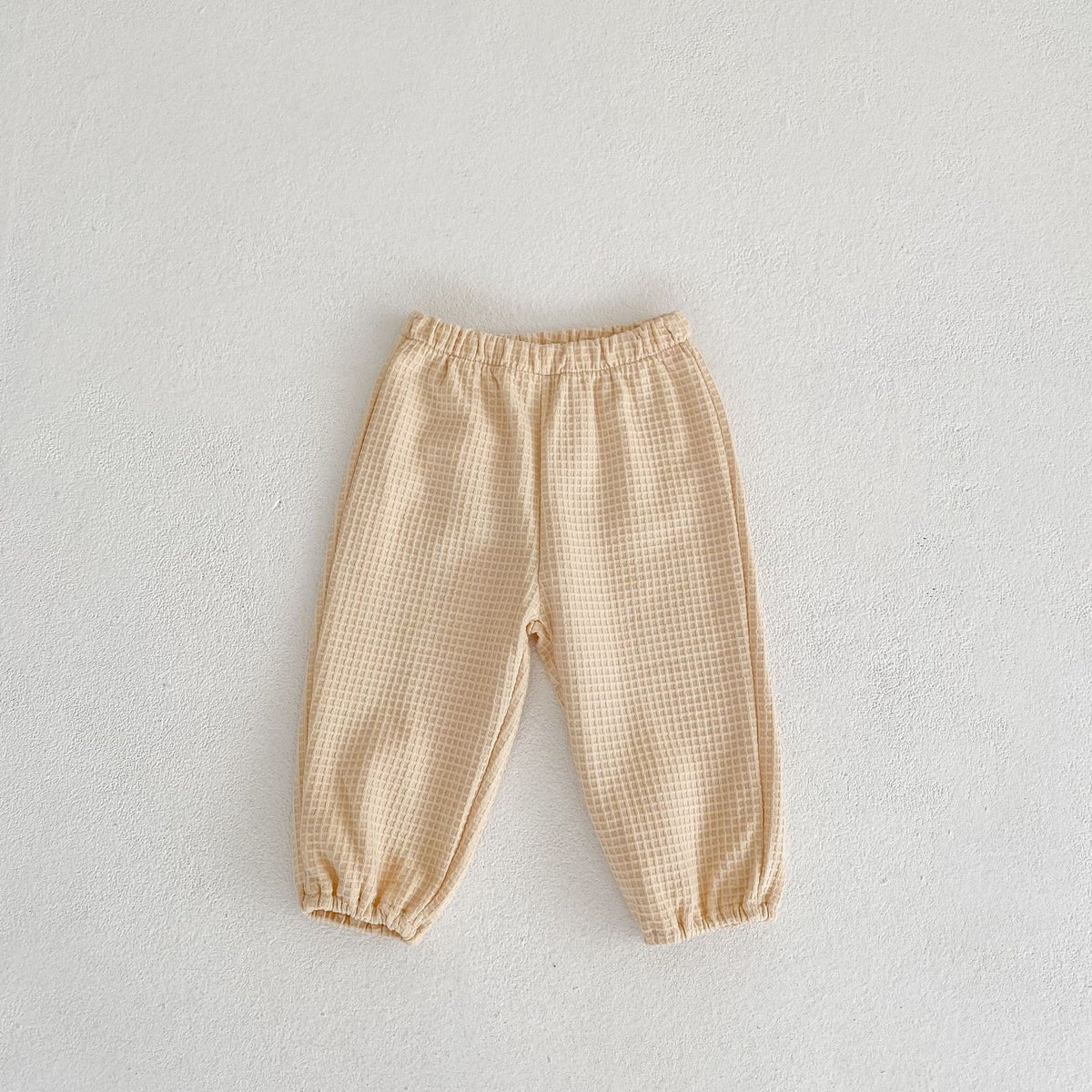 Pantalon ample et polyvalent pour enfants en tissu gaufré
