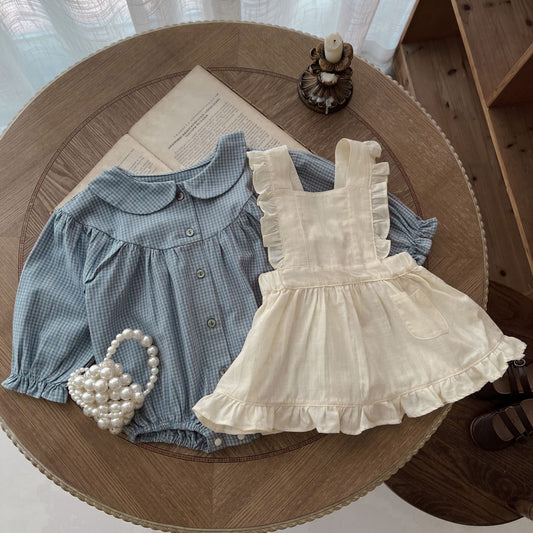 Combinaison bébé à manches longues, boutonnage simple, petit carreau et petite surjupe à bretelles